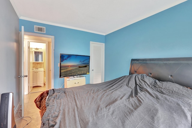 bedroom with light tile floors and ornamental molding