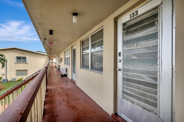 balcony featuring central AC and wine cooler