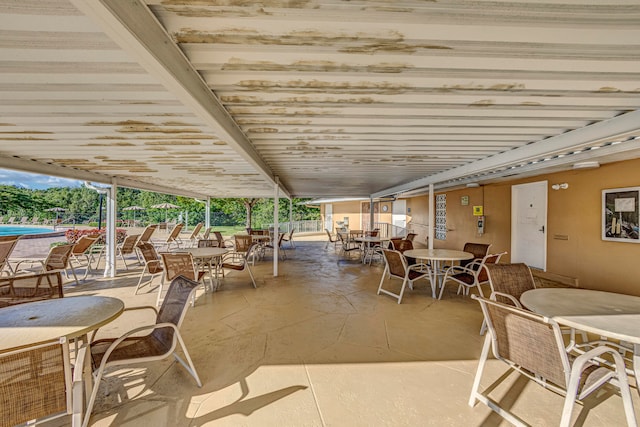 view of patio with a swimming pool