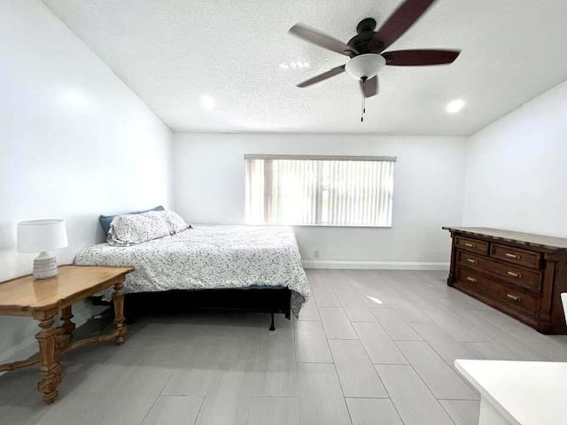 bedroom featuring a textured ceiling and ceiling fan