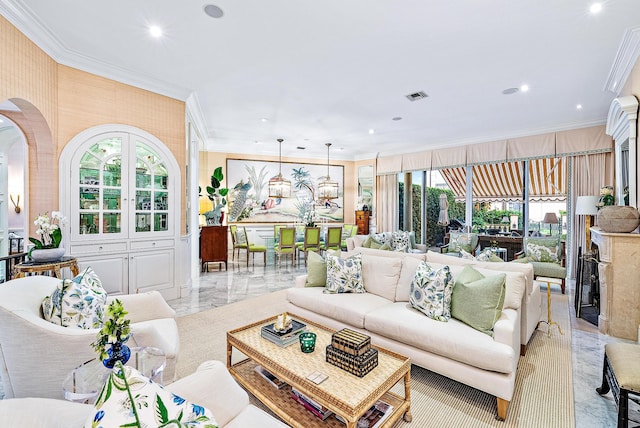 tiled living room featuring a healthy amount of sunlight and ornamental molding