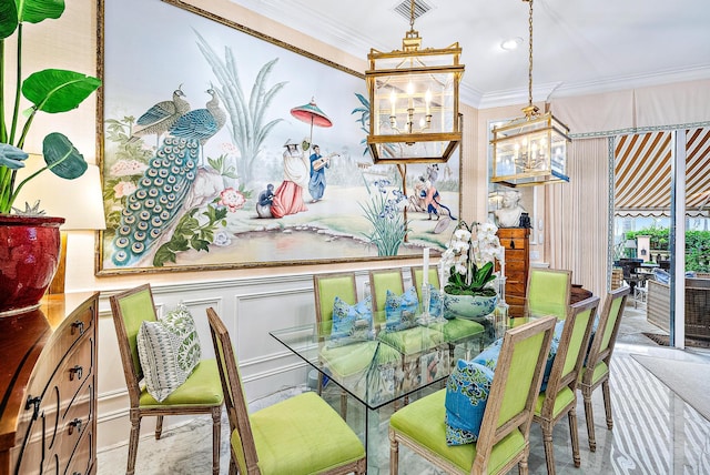 dining area with a chandelier and ornamental molding