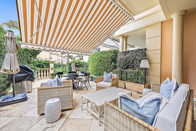 view of patio / terrace featuring an outdoor living space and grilling area