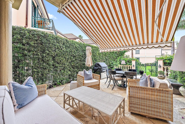 view of terrace featuring a grill and outdoor lounge area