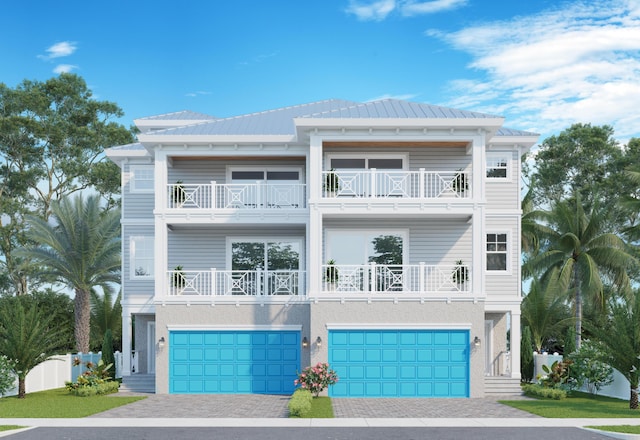 raised beach house with a balcony and a garage