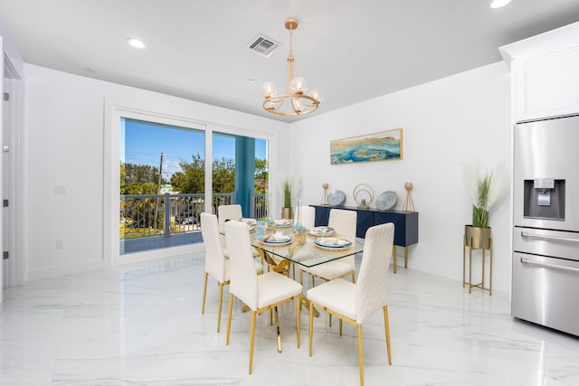 dining space featuring an inviting chandelier