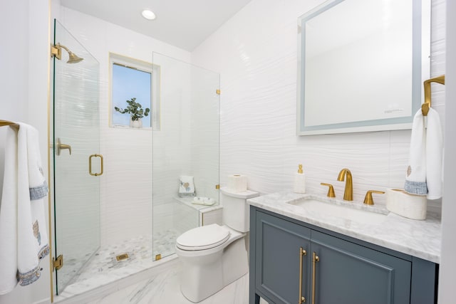 bathroom featuring vanity, toilet, tile walls, and an enclosed shower