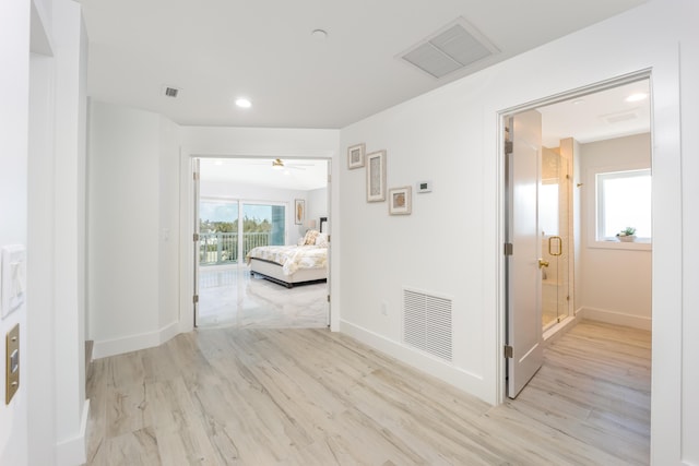 corridor featuring light hardwood / wood-style flooring