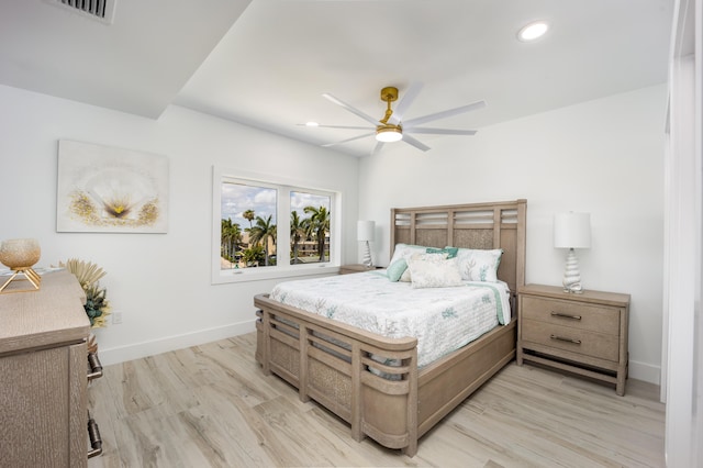 bedroom featuring ceiling fan and light hardwood / wood-style flooring