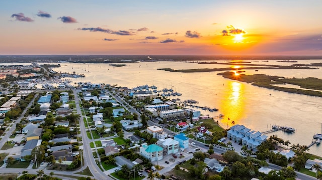 aerial view at dusk with a water view