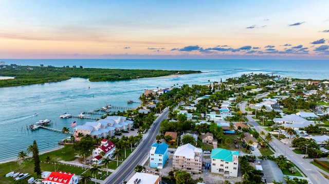 aerial view at dusk with a water view