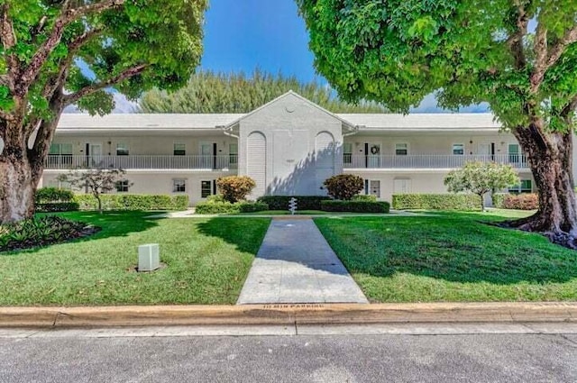 view of front of home with a front yard