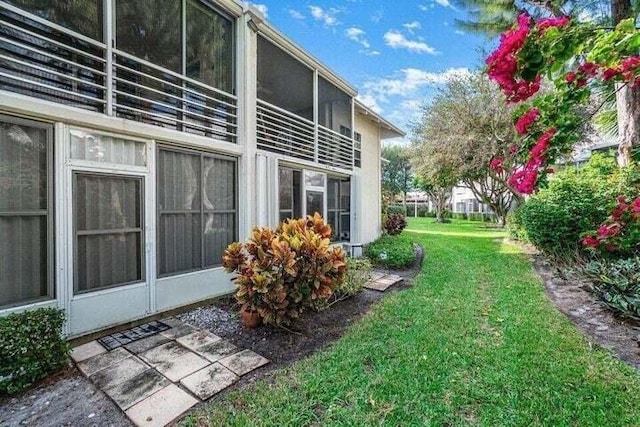 view of home's exterior with a yard