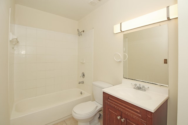 full bathroom with tiled shower / bath, toilet, tile flooring, and vanity