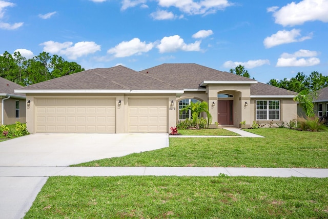 view of front of home featuring a garage and a front yard