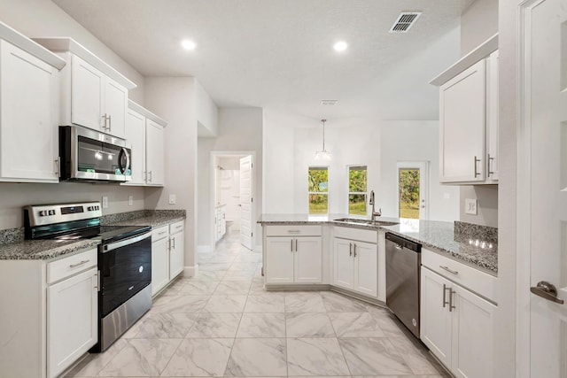 kitchen featuring kitchen peninsula, stainless steel appliances, white cabinetry, and sink