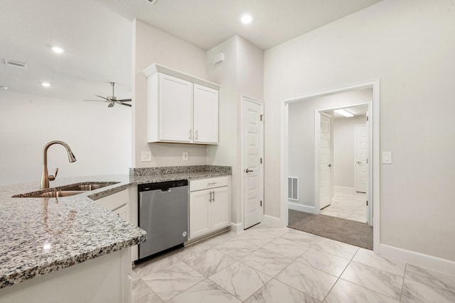 kitchen with sink, stainless steel dishwasher, ceiling fan, light stone countertops, and white cabinetry