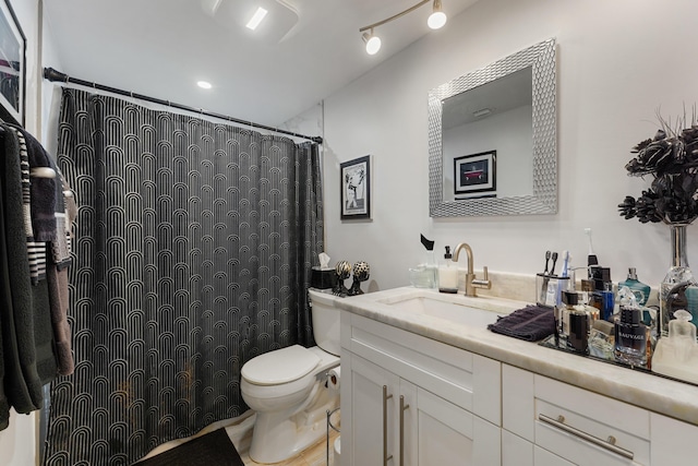 bathroom featuring vanity and toilet