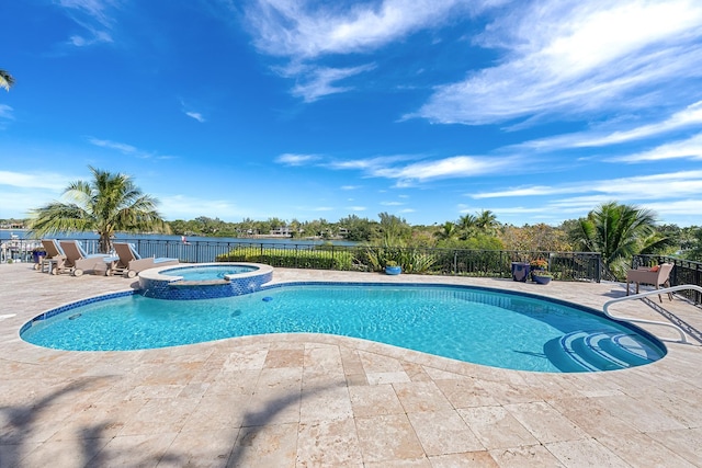 view of pool with an in ground hot tub and a patio