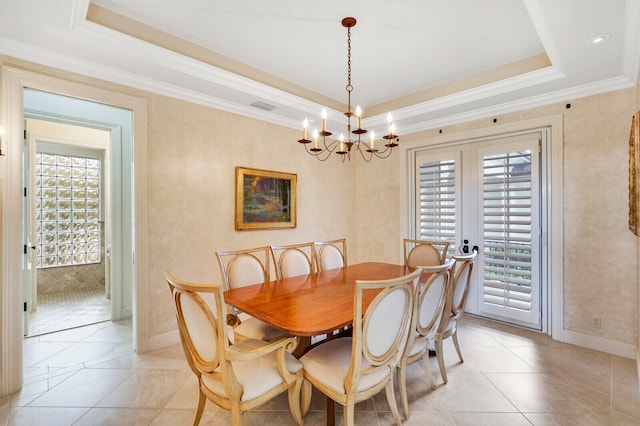 dining area featuring light tile flooring, a tray ceiling, french doors, and an inviting chandelier