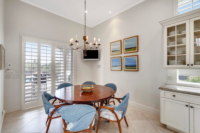 tiled dining area featuring an inviting chandelier