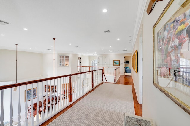 hallway featuring crown molding and wood-type flooring