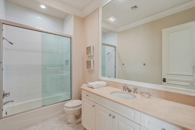 full bathroom with toilet, vanity, ornamental molding, tile floors, and bath / shower combo with glass door