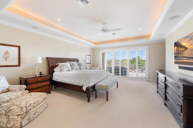 carpeted bedroom featuring ceiling fan, ornamental molding, a raised ceiling, and access to outside