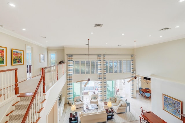 corridor featuring light tile floors and crown molding