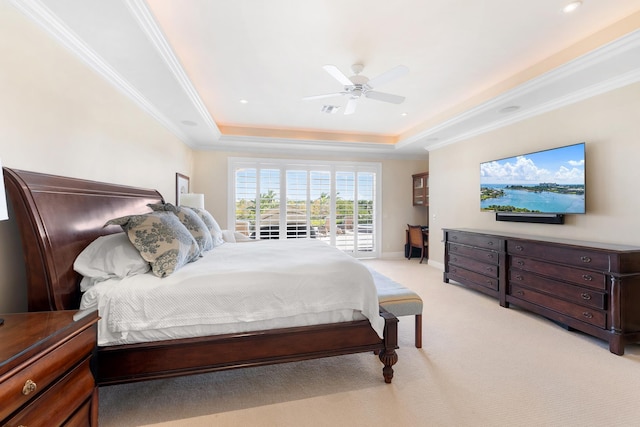 bedroom featuring light colored carpet, access to exterior, ceiling fan, a raised ceiling, and crown molding