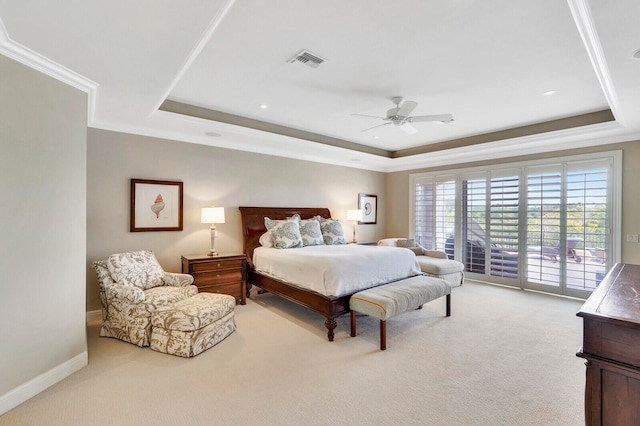 carpeted bedroom with access to outside, crown molding, a tray ceiling, and ceiling fan