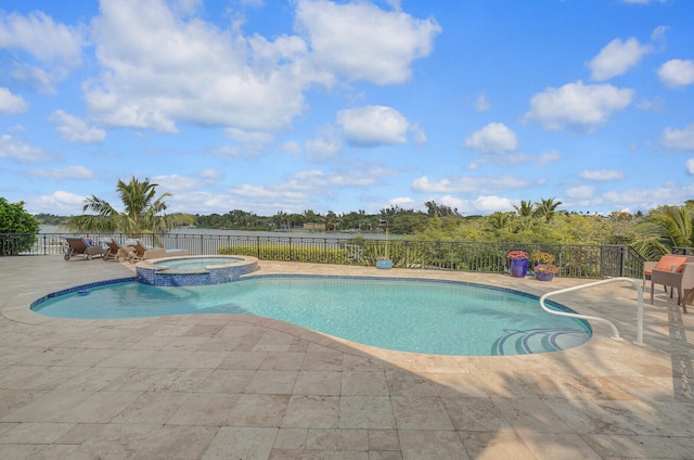 view of pool with an in ground hot tub and a patio area