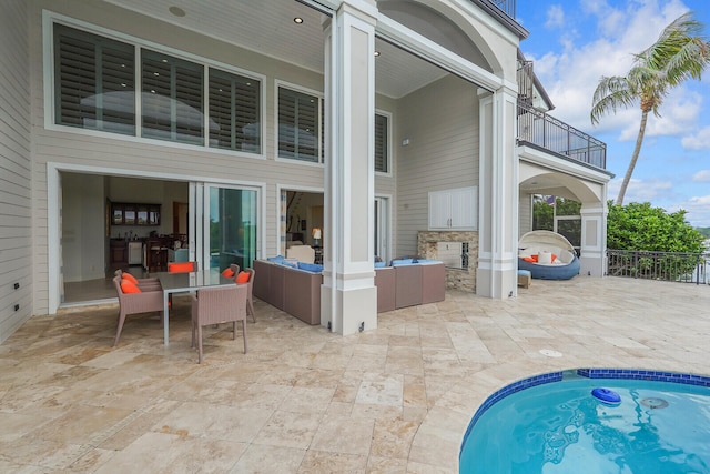 exterior space featuring a balcony, area for grilling, and a patio area