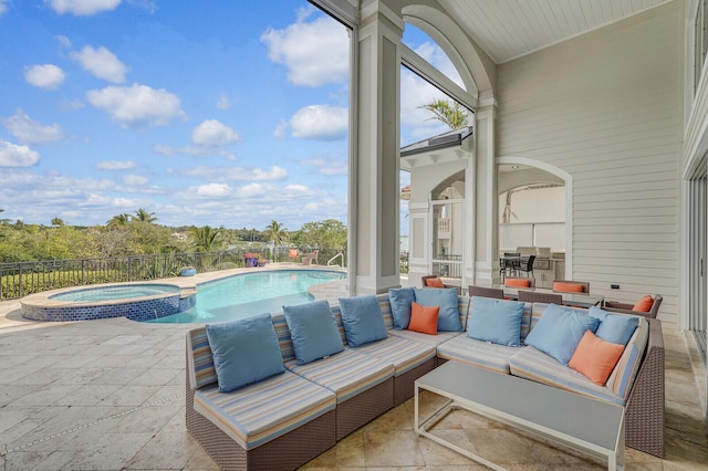 view of patio featuring a swimming pool with hot tub and outdoor lounge area