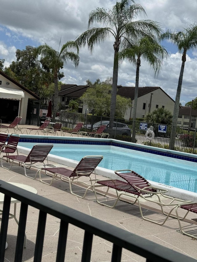 view of swimming pool featuring a patio area