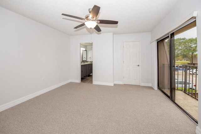 empty room featuring light carpet and ceiling fan