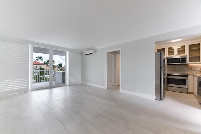 unfurnished living room with an AC wall unit and crown molding