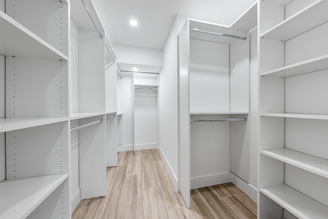 walk in closet featuring light hardwood / wood-style flooring