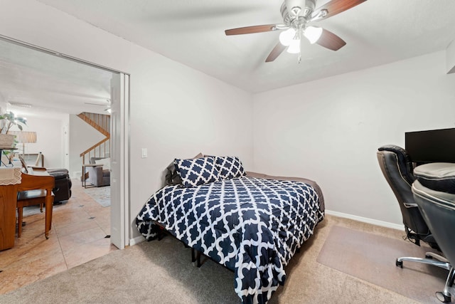 tiled bedroom with ceiling fan