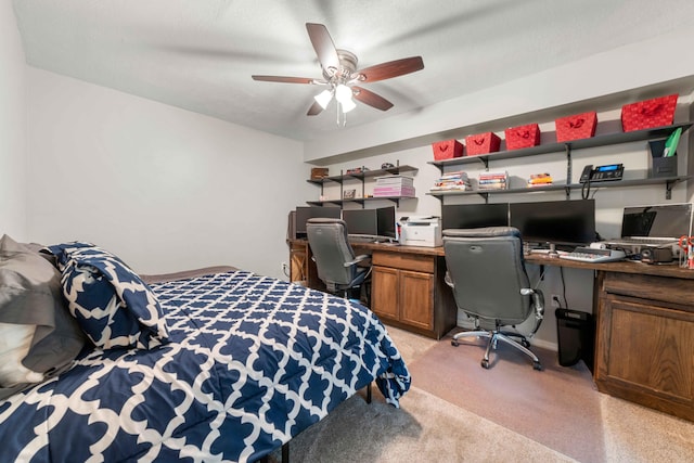 carpeted bedroom with a textured ceiling and ceiling fan