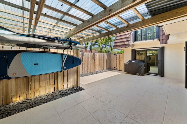 view of patio featuring grilling area and a pergola