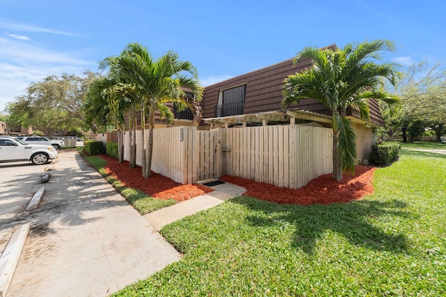 view of side of property featuring a yard