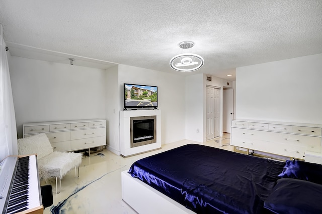 bedroom featuring a textured ceiling