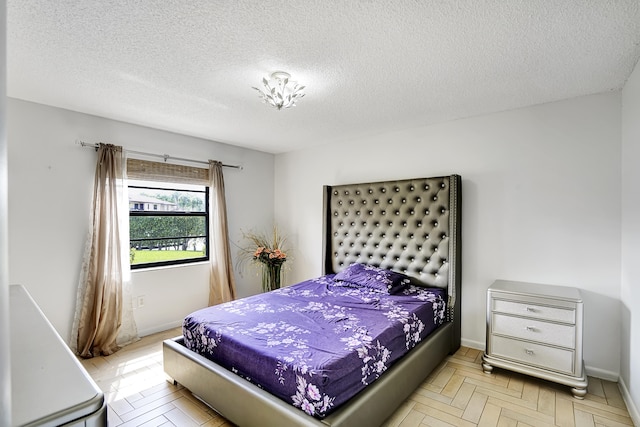 bedroom featuring a textured ceiling