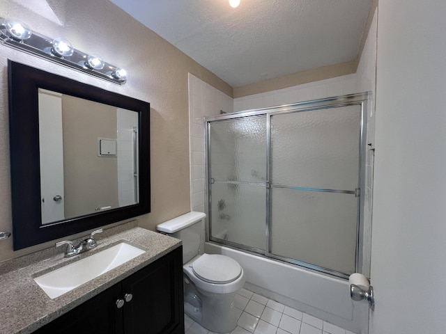 full bath with toilet, enclosed tub / shower combo, a textured ceiling, vanity, and tile patterned floors