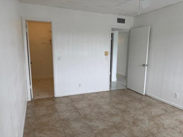 unfurnished bedroom with visible vents