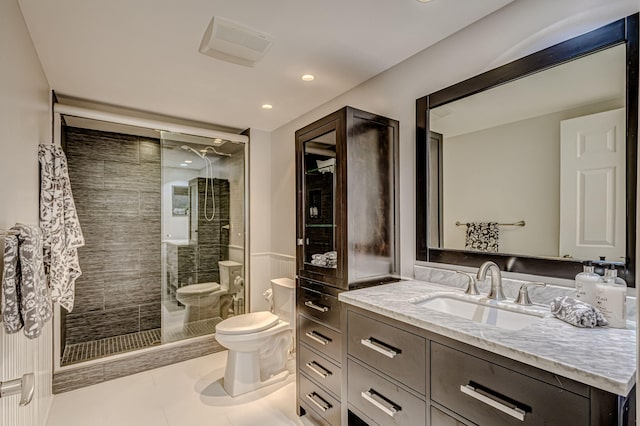 bathroom featuring toilet, a bidet, vanity, walk in shower, and tile floors