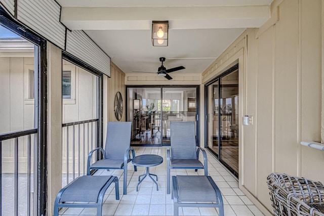 sunroom featuring ceiling fan