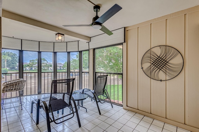 sunroom featuring ceiling fan and a wealth of natural light