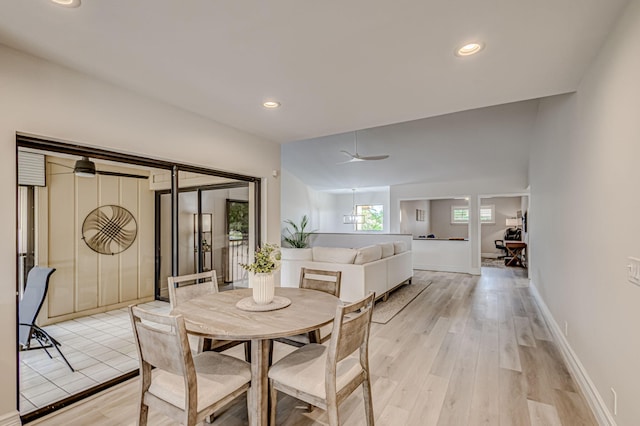 dining room with french doors, ceiling fan, and light wood-type flooring